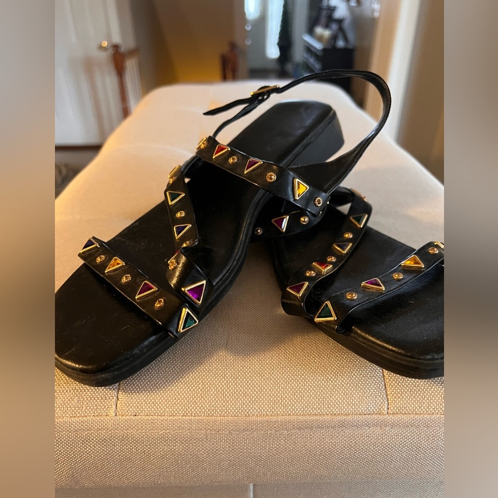 Black sandals with gold/color embellishments